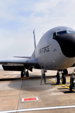 313TH AIR EXPEDITIONARY WING --  A 22nd Aircraft Maintenance Squadron crew chief, deployed from McConnell Air Force Base, Kan., plugs a generator power cable into a KC-135 Stratotanker here March 25 in support of Joint Task Force Odyssey Dawn. Joint Task Force Odyssey Dawn is the U.S. Africa Command task force established to provide operational and tactical command and control of U.S. military forces supporting the international response to the unrest in Libya and enforcement of United Nations Security Council Resolution (UNSCR) 1973. UNSCR 1973 authorizes all necessary measures to protect civilians in Libya under threat of attack by Gadhafi regime forces. JTF Odyssey Dawn is commanded by U.S. Navy Admiral Samuel J. Locklear, III. (U.S. Air Force photo/Senior Airman Ethan Morgan)