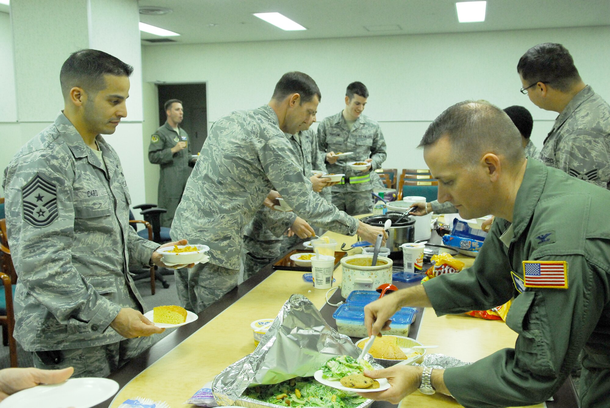 YOKOTA AIR BASE, Japan -- Members from the 374th Airlift Wing enjoy a chili dinner provided by volunteers March 30. Operation Tomodachi has been a total effort from the beginning, with spouses and volunteers working alongside, and in support of, the men and women in uniform. (U.S. Air Force photo/Staff Sgt. Robin Stanchak)