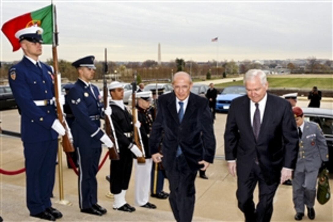 U.S. Defense Secretary Robert M. Gates, right, escorts Portuguese Defense Minister Augusto Santos Silva through an honor cordon into the Pentagon, March 30, 2011. The two defense leaders were to hold bilateral security talks on a broad range of issues.
