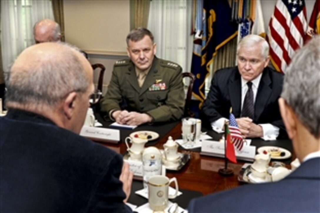 U.S. Defense Secretary Robert M. Gates, far side of table, hosts a meeting with Portuguese Defense Minister Augusto Santos Silva, left foreground, at the Pentagon, March 30, 2011. Marine Corps Gen. James E. Cartwright, vice chairman of the Joint Chiefs of Staff, and James Townsend, deputy assistant secretary of defense for Europe and NATO, joined Gates.