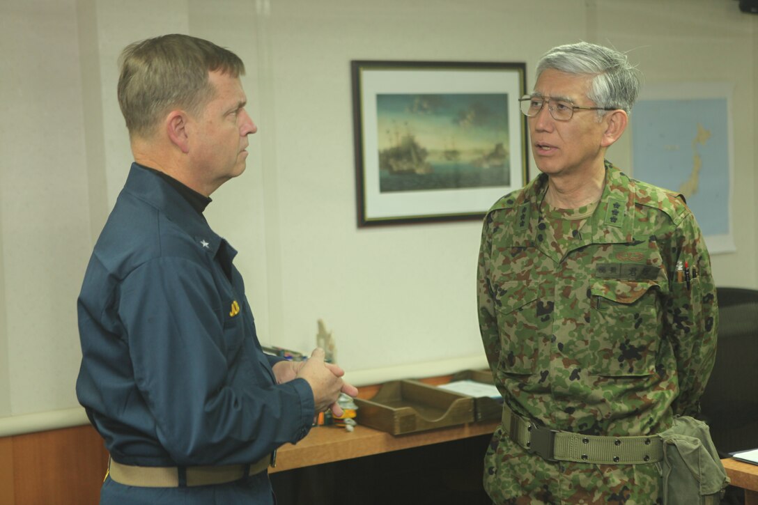 Rear Adm. Jeffery Jones (left), director, Coalition Naval Advisory and Training Team (Iraq), speaks with Eija Kimizuka, commander of Joint Task Force-Tohoku, during Kimizuka’s visit aboard USS Essex (LHD 2), March 31. Kimizuka received a tour of the ship and a brief on the 31st MEU’s and Amphibious Squadron 11’s participation in Operation Tomodachi.