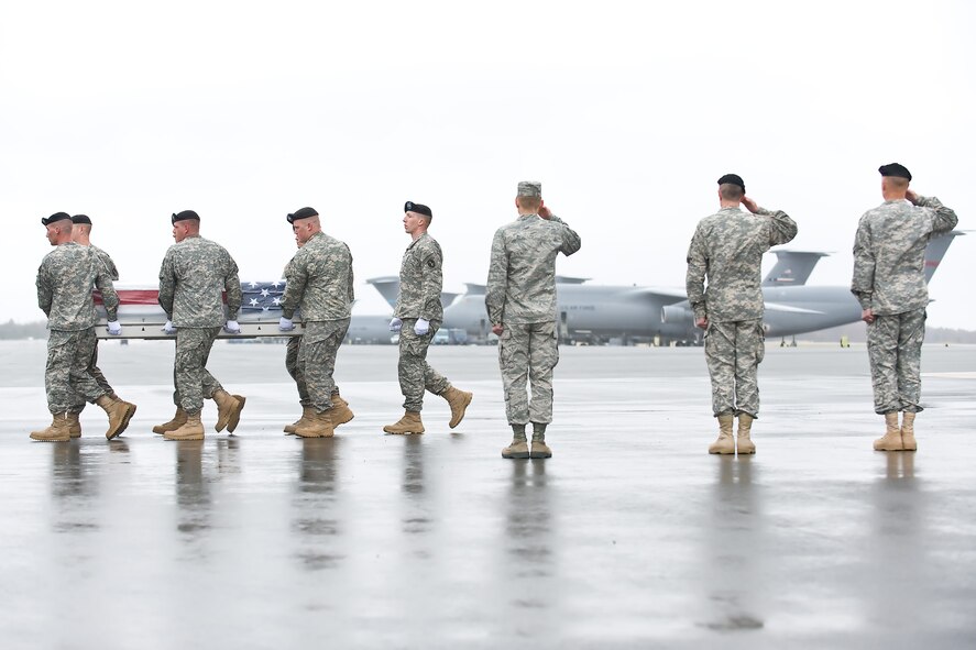 A U.S. Army carry team transfers the remains of Army Pvt. Jeremy P. Faulkner, of Griffin, Ga., at Dover Air Force Base, Del., March 31, 2011. Faulkner was assigned to the 2nd Battalion, 327th Infantry Regiment, 1st Brigade Combat Team, 101st Airborne Division (Air Assault), Fort Campbell, Ky. (U.S. Air Force photo/Roland Balik)