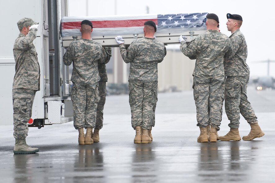 A U.S. Army carry team transfers the remains of Army Spc. Jameson L. Lindskog, of Pleasanton, Calif., at Dover Air Force Base, Del., March 31, 2011. Lindskog was assigned to the 2nd Battalion, 327th Infantry Regiment, 1st Brigade Combat Team, 101st Airborne Division (Air Assault), Fort Campbell, Ky. (U.S. Air Force photo/Roland Balik)