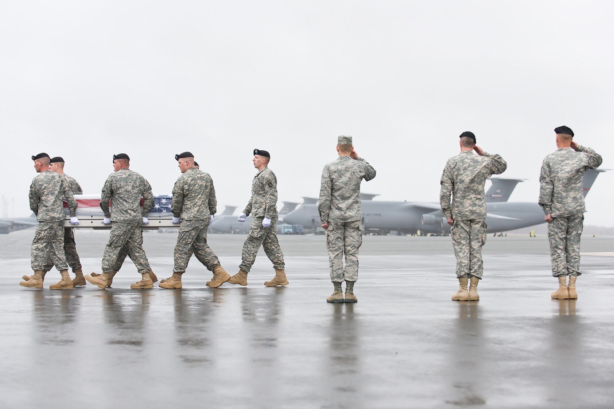 A U.S. Army carry team transfers the remains of Army Sgt. 1st Class Ofren Arrechaga, of Hialeah, Fla., at Dover Air Force Base, Del., March 31, 2011. Arrechaga was assigned to the 2nd Battalion, 327th Infantry Regiment, 1st Brigade Combat Team, 101st Airborne Division (Air Assault), Fort Campbell, Ky. (U.S. Air Force photo/Roland Balik)