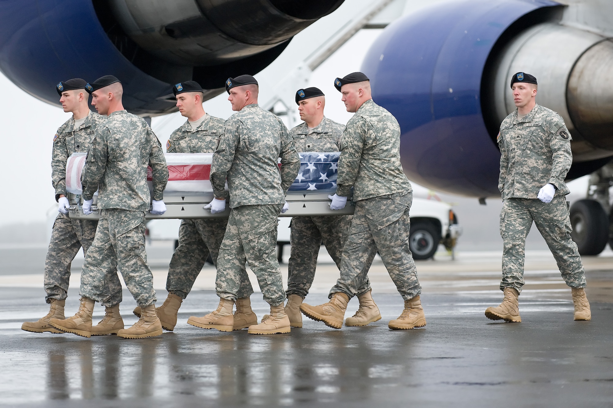 A U.S. Army carry team transfers the remains of Army Staff Sgt. Frank E. Adamski III, of Moosup, Conn., at Dover Air Force Base, Del., March 31, 2011. Adamski was assigned to the 2nd Battalion, 327th Infantry Regiment, 1st Brigade Combat Team, 101st Airborne Division (Air Assault), Fort Campbell, Ky. (U.S. Air Force photo/Roland Balik)