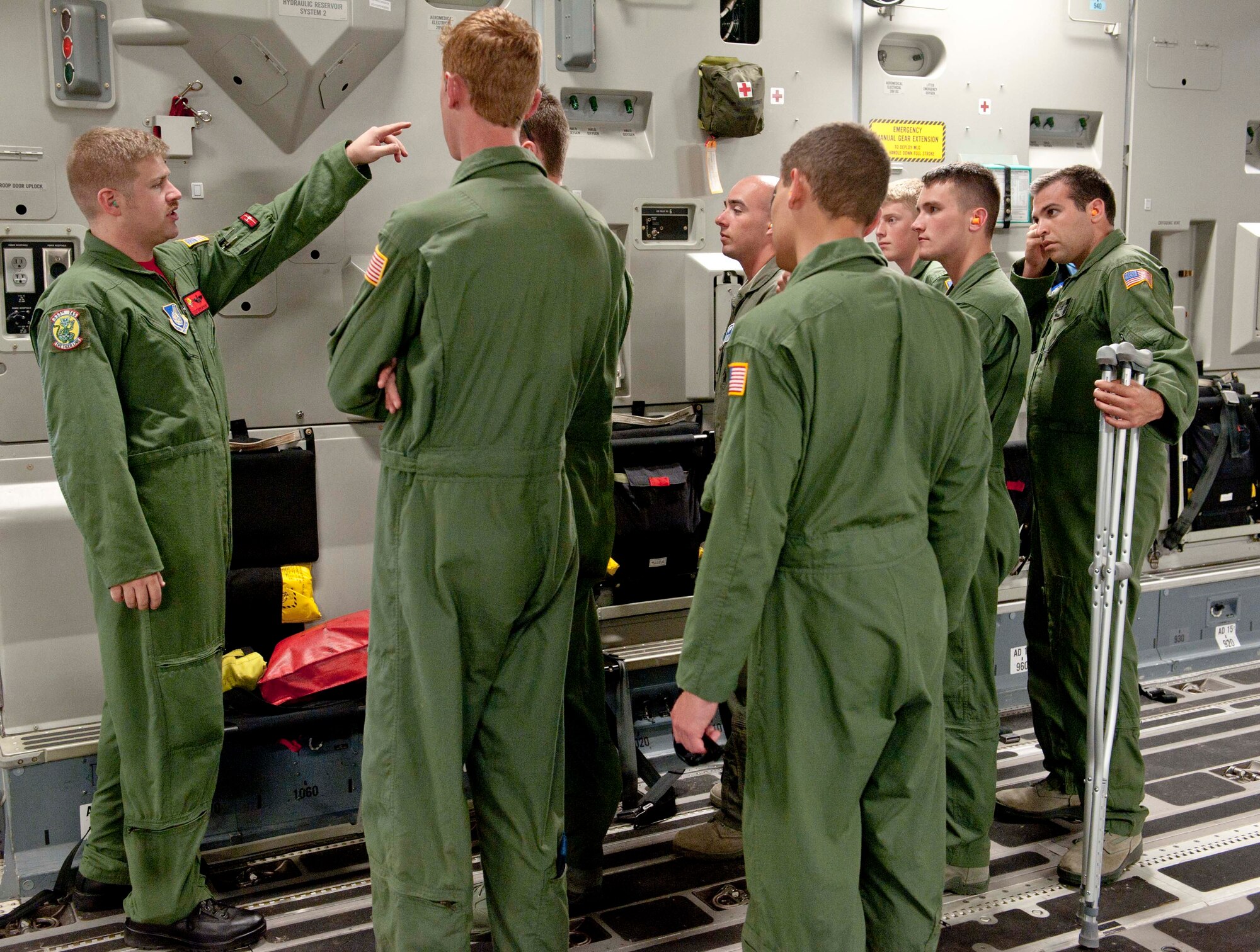 Staff Sgt. Robert Wyman, 535th Airlift Squadron loadmaster, gives a pre-flight briefing to cadets from the "Fightin' Fourth," or Fourth Cadet Squadron at the U.S. Air Force Academy in Colorado Springs, Colo. Mar. 25 at Joint Base Pearl Harbor-Hickam, Hawaii. During the 15th Wing sponsored tour, the cadets visited various agencies around base to get a glimpse of what the operational Air Force looks like. (U.S. Air Force photo by Staff Sgt. Nathan Allen)