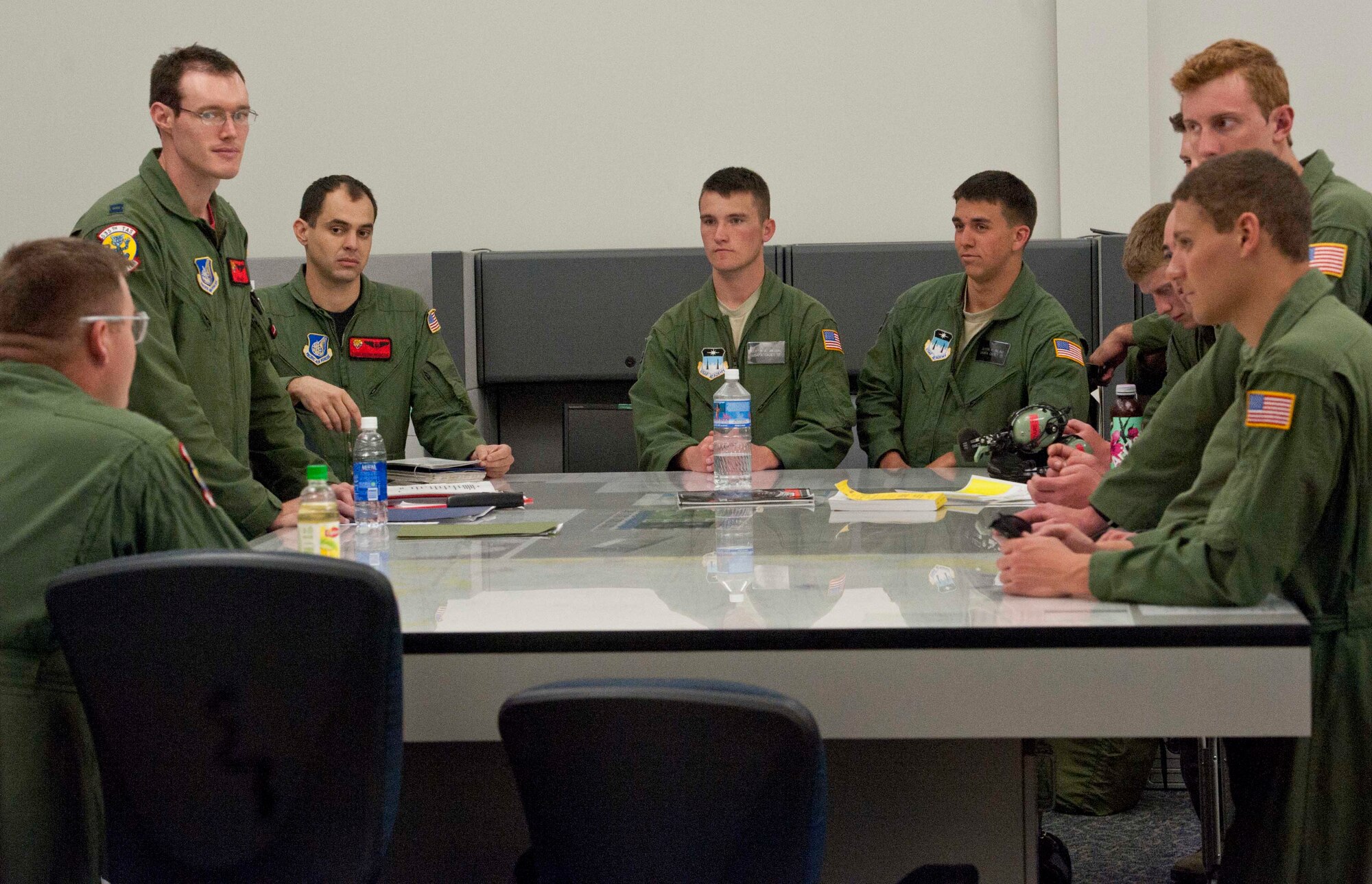 Cadets from the "Fightin' Fourth," or Fourth Cadet Squadron at the U.S. Air Force Academy in Colorado Springs, Colo. recieve a pre-flight briefing Mar. 25 from a 535th Airlift Squadron aircrew at Joint Base Pearl Harbor-Hickam, Hawaii. During the 15th Wing sponsored tour, the cadets visited various agencies around base to get a glimpse of what the operational Air Force looks like. (U.S. Air Force photo by Staff Sgt. Nathan Allen)
