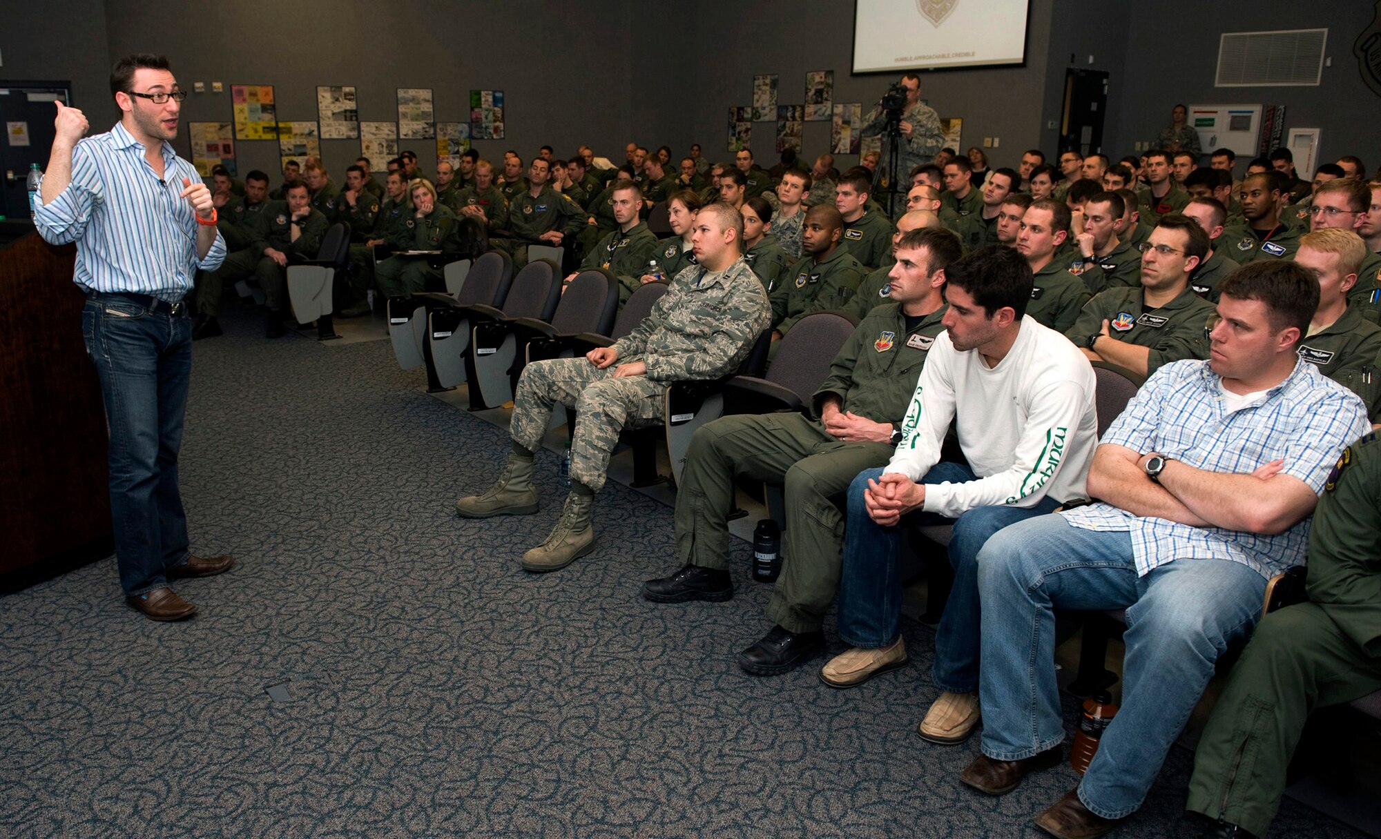 NELLIS AIR FORCE BASE, Nev. -- Simon Sinek, internationally renowned speaker and author, communicates leadership strategy to U.S. Air Force Weapons School students Feb. 22. Mr. Sinek hosted a presentation at the U.S. Air Force Weapons School to teach students about changing their focus toward leadership and less focus on tactics. (U.S. Air Force photo by Senior Airman Brett Clashman)
