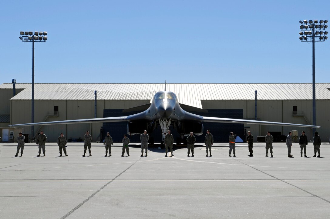 Airmen from the 28th Bomb Wing stand in place to great the return of two B-1B Lancers on Ellsworth Air Force Base, S.D., March 30, 2011.   The B-1s bombed targets in Libya in support of Operation Odyssey Dawn. (U.S. Air Force photo/Staff Sgt. Marc I. Lane)