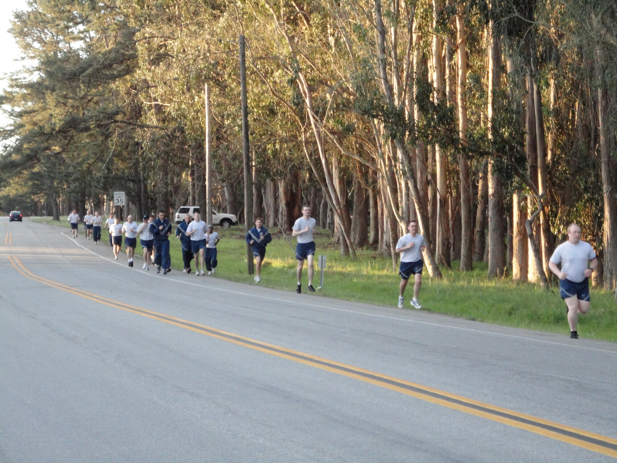 VANDENBERG AIR FORCE BASE, Calif. - Airmen from the 30th Space Communications Squadron run along Washington Avenue here Wednesday, March 30, 2011, during a unit physical training session. (Courtesy photo)