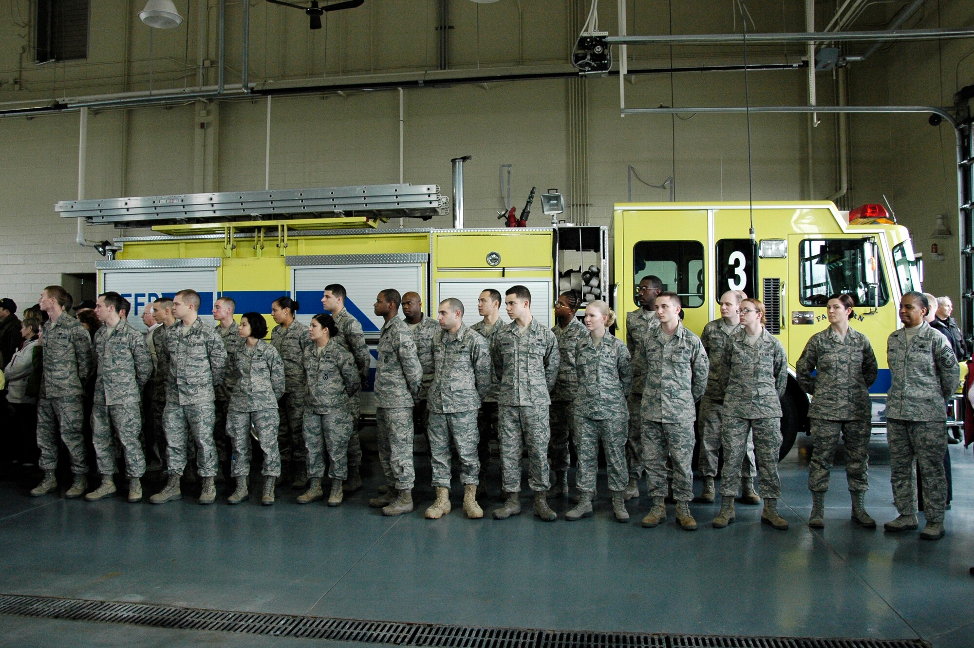 Chief Master Sgt. Shelina Frey joins Airman from Wright-Patteson Air Force Base listening to the story of the trek of a large steel beam from New York's World Trade Center during a ceremony marking its arrival to Fairborn, Ohio March 25, 2011.  The artifact will become part of a permanent memorial to honor first responders and victims of the 9/11 terrorists attacks.  It will be located at the National Center for Medical Readiness, located in Fairborn near Wright-Patterson Air Force Base. Chief Frey is Command Chief for Aeronautical Systems Center and the 88th Air Base Wing. (Skywrighter photo/Niki Jahns)