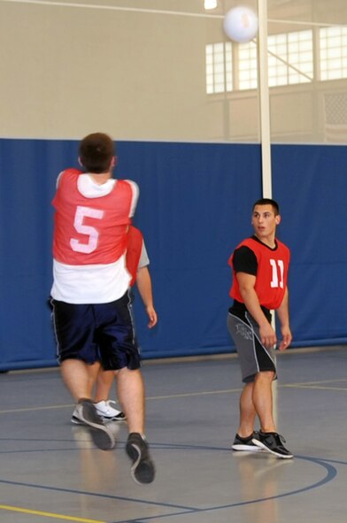 Airmen from the 2nd Comptroller Squadron play a game of volleyball against Airmen from the 26th Operational Weather Squadron at the fitness center on Barksdale Air Force Base, La., March 30. The 26 OWS won two out of the three games, making them the victors. (U.S. Air Force photo/Senior Airman Brittany Y. Bateman)(RELEASED)