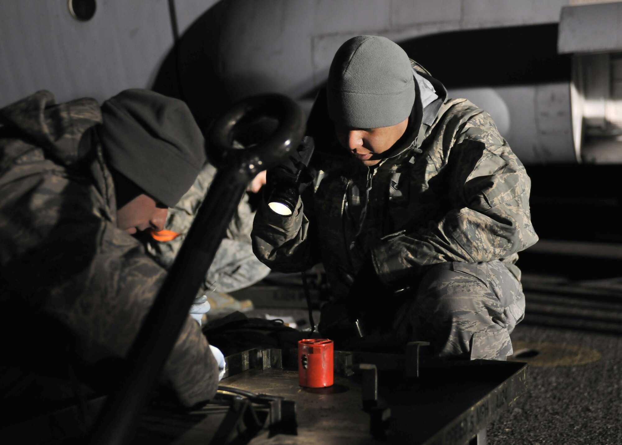 YOKOTA AIR BASE, Japan -- Staff Sgt. Neal Peterson and Staff Sgt. Benjamin Zavala, 374th Aircraft Maintenance Squadron crew chiefs, replaces breaks on a C-130 Hercules here March 31, 2011. Altogether, Yokota's C-130 aircraft have logged over 300 flight hours carrying fuel, supplies and personnel in support of Operation Tomodachi. Careful and constant maintenance ensures continued flight operations in support of the nation of Japan. (U.S. Air Force photo/Airman 1st Class Andrea Salazar)