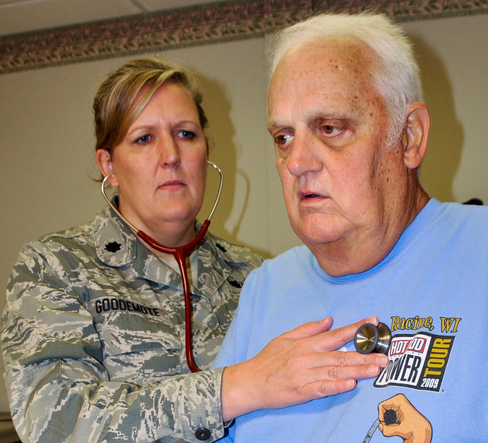 Lt. Col. Patricia Goodemote, Eglin hospital’s assistant program director of family medicine residency, performs a check-up on retired Chief Master Sgt. Tom Huene.  Colonel Goodemote was recently named 2011 Physician of the Year by Uniformed Services Academy of Family Physicians.  (U.S. Air Force photo/Kevin Gaddie)

