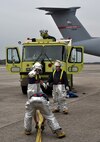 Westover firefighters participated in an egress drill evaluation, which simulated a fire in a C-5 parked on the flight line March 31. Westover firefighters practice different C-5 fire situations once every three months to keep all their men trained and ready at a moment’s notice. (US Air Force photo/Airman 1st Class Alexander Brown)