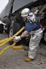 Westover firefighters participated in an egress drill evaluation, which simulated a fire in a C-5 parked on the flight line March 31. Westover firefighters practice different C-5 fire situations once every three months to keep all their men trained and ready at a moment’s notice. (US Air Force photo/Airman 1st Class Alexander Brown)