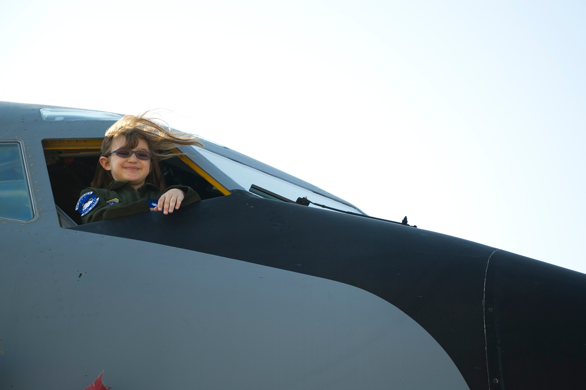 Kara Marr, 10, Pilot for a Day recipient, looks out the window from the flight deck of a KC-135 Stratotanker March 25, 2011, McConnell Air Force Base, Kan.  Kara, who was diagnosed with a chronic kidney disease, and her family toured the base with members of the 344th Air Refueling Squadron as part of the Pilot for a Day program, an Air Force program that allows medically-challenged youth a chance to visit a base and become part of the Air Force team. (U.S. Air Force photo/Staff Sgt. Michael Keller)