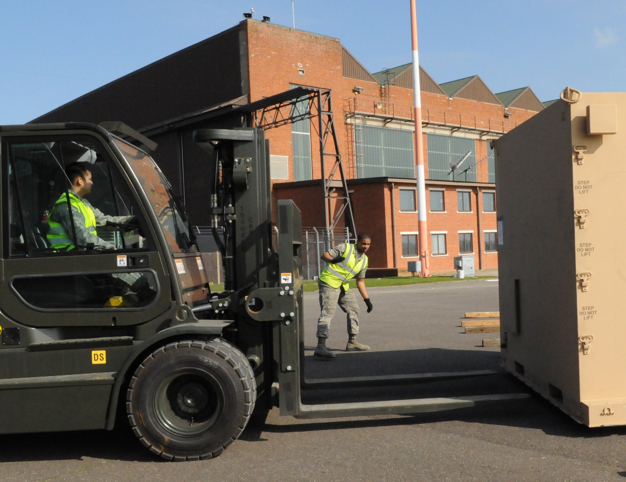 Airmen from the 100th Logistics Readiness Squadron cargo deployment function prepare to load a pallet on to a forklift to move the pallet into temporary storage here March 23, 2011. The pallet will be sent via air lift to support Joint Task Force Odyssey Dawn.  JTF Odyssey Dawn is the U.S. Africa Command task force established to provide operational and tactical command and control of U.S. military forces supporting the international response to the unrest in Libya and enforcement of United Nations Security Council Resolution (UNSCR) 1973. UNSCR 1973 authorizes "all necessary measures" to protect civilians in Libya under threat of attack by Gadhafi regime forces. JTF Odyssey Dawn is commanded by U.S. Navy Admiral Sam Locklear. (U.S. Air Force photo by Airman 1st Class Rachel Waller/Unreleased)