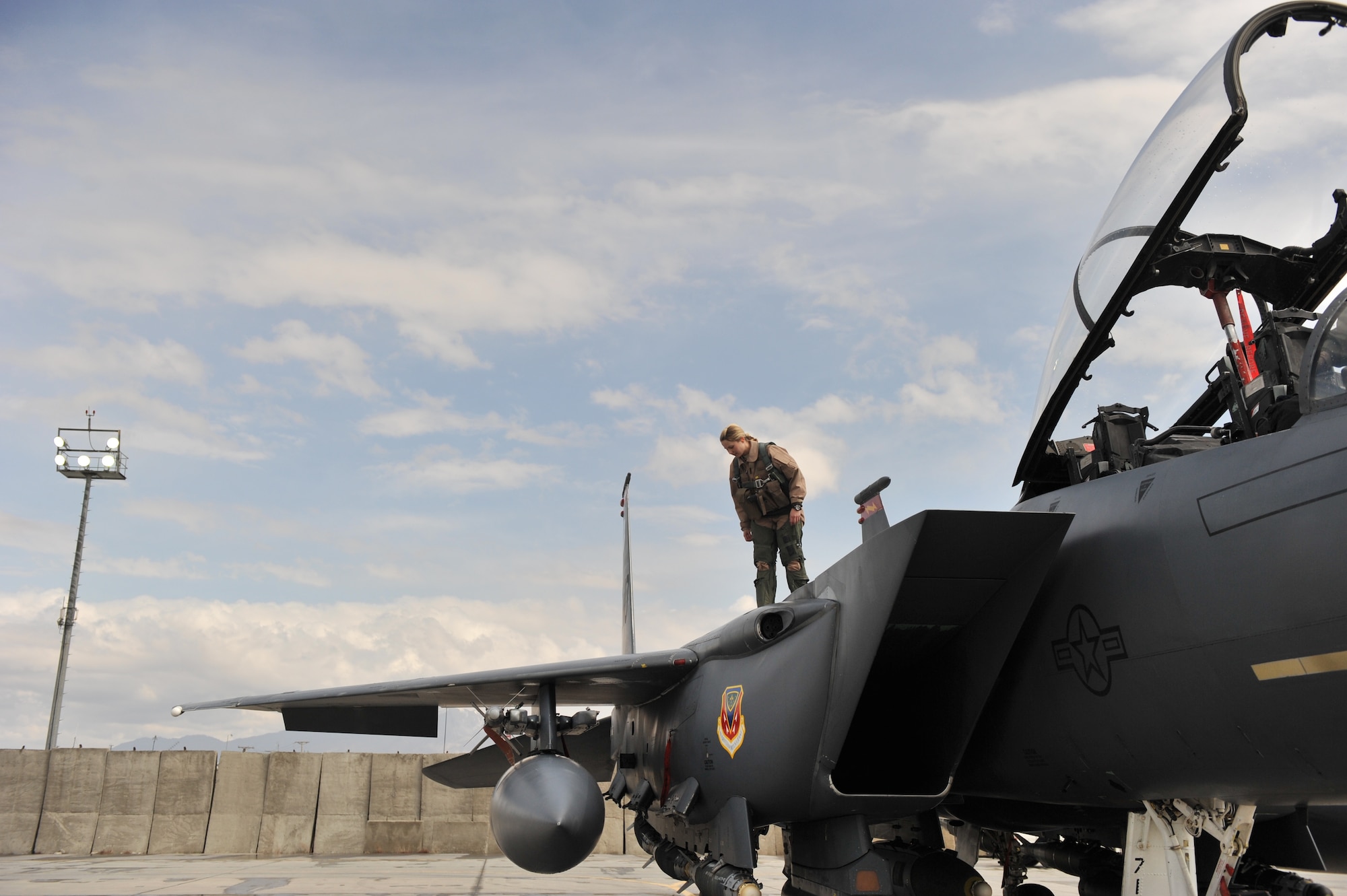 Capt. Jennifer Morton, 389th Expeditionary Fighter Squadron weapons system officer, does a pre-flight inspection before take-off at Bagram Airfield, Afghanistan, March 29, 2011. (U.S. Air Force photo by Senior Airman Sheila deVera)