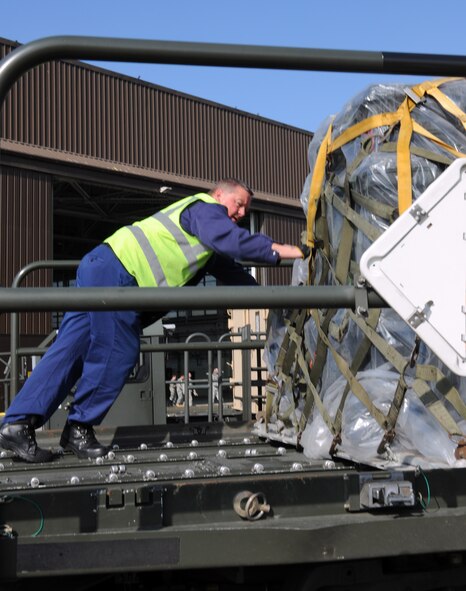 A member from the 100th Logistics Readiness Squadron cargo deployment function prepare to move a pallet here March 23, 2011. The pallet will be sent via airlift to support Joint Task Force Odyssey Dawn.  JTF Odyssey Dawn is the U.S. Africa Command task force established to provide operational and tactical command and control of U.S. military forces supporting the international response to the unrest in Libya and enforcement of United Nations Security Council Resolution (UNSCR) 1973. UNSCR 1973 authorizes "all necessary measures" to protect civilians in Libya under threat of attack by Gadhafi regime forces. JTF Odyssey Dawn is commanded by U.S. Navy Admiral Sam Locklear. (U.S. Air Force photo by Senior Airman Tabitha Lee/Released)