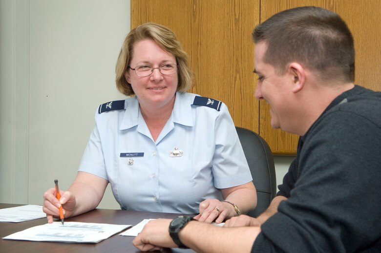 HANSCOM AIR FORCE BASE, Mass. – Col. Stacy McNutt, Battle Management deputy director and the directorate’s energy competition “champion” goes over a mock utility bill with Bob Lesko, Building 1612’s facility manager, March 28. Several base organizations, like Battle Management, have been sending out energy saving tips and gathering energy awareness information from employees as part of the campaign to reduce energy consumption. (U.S. Air Force photo by Mark Wyatt)