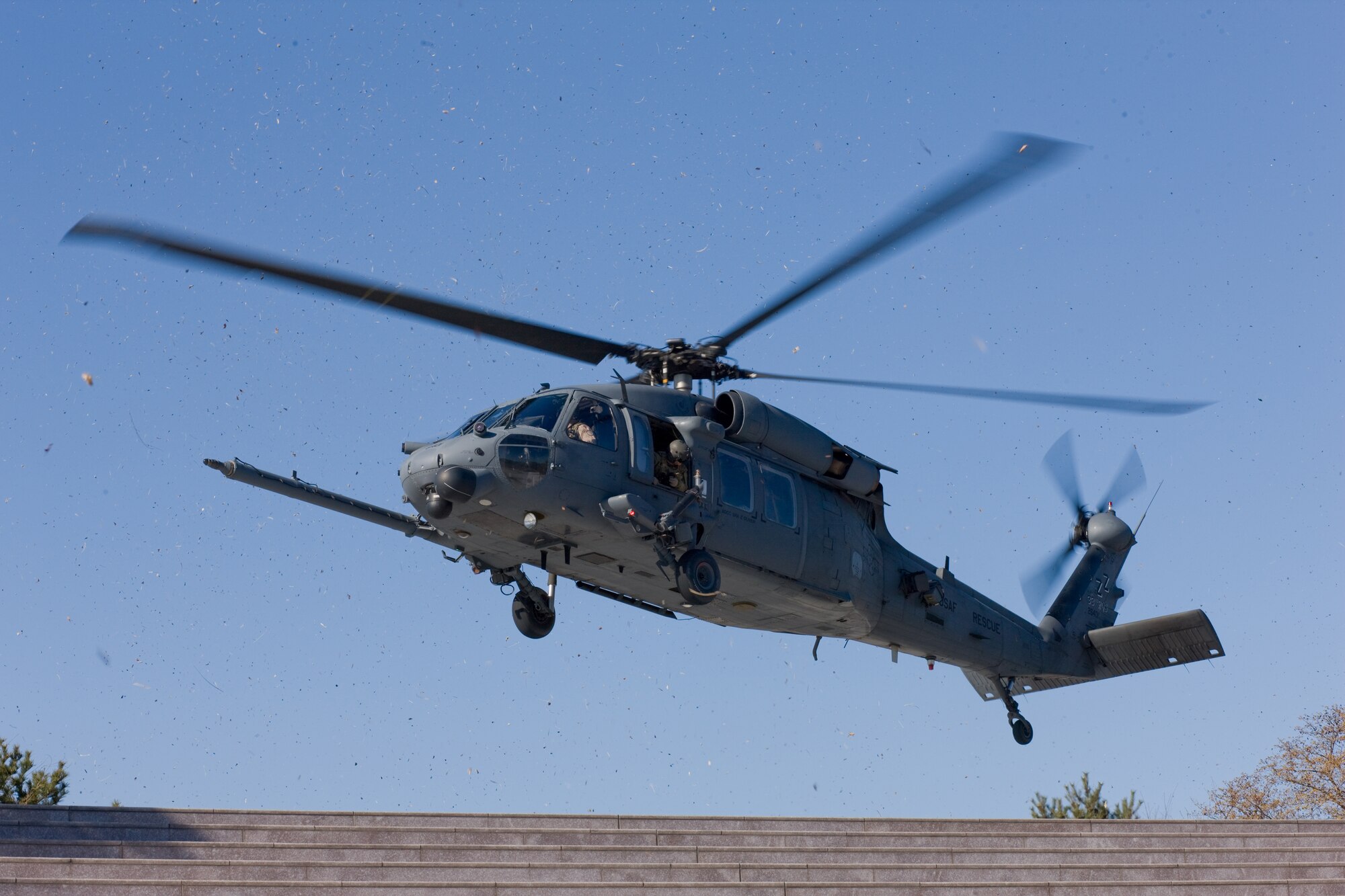 ONAHAMA, Japan -- An HH-60G Pave Hawk lands at Misaki Park to transport Australian volunteers and U.S. service members to assist with building a water pump system to transport fresh water into the Fukushima nuclear power plant instead of ocean water, March 28, 2011. The U.S. military is fully committed to supporting the disaster response efforts of the Government of Japan and the Japan Self-Defense Force. (U.S. Air Force photo/Osakabe Yasuo)