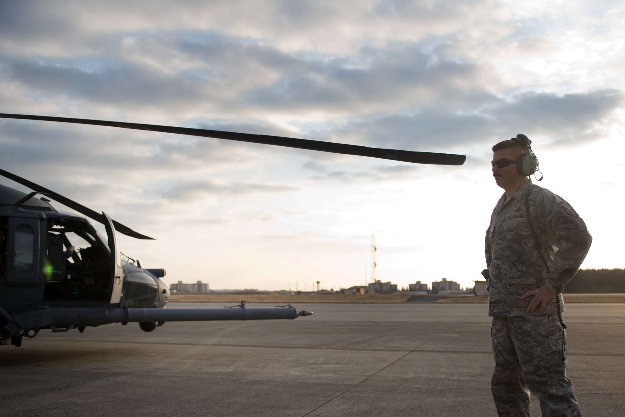 YOKOTA AIR BASE, Japan -- Master Sgt. James Ray, 718th Aircraft Maintenance Squadron, completes preflight checks on an HH-60G pave hawk before taking off at Yokota Air Base, March 28, 2011. Sergeant Ray is deployed here from Kadena Air Base in support of Operation Tomodachi. The U.S. military is fully committed to supporting the disaster response efforts of the Government of Japan and the Japan Self-Defense Force. (U.S. Air Force photo/Osakabe Yasuo)