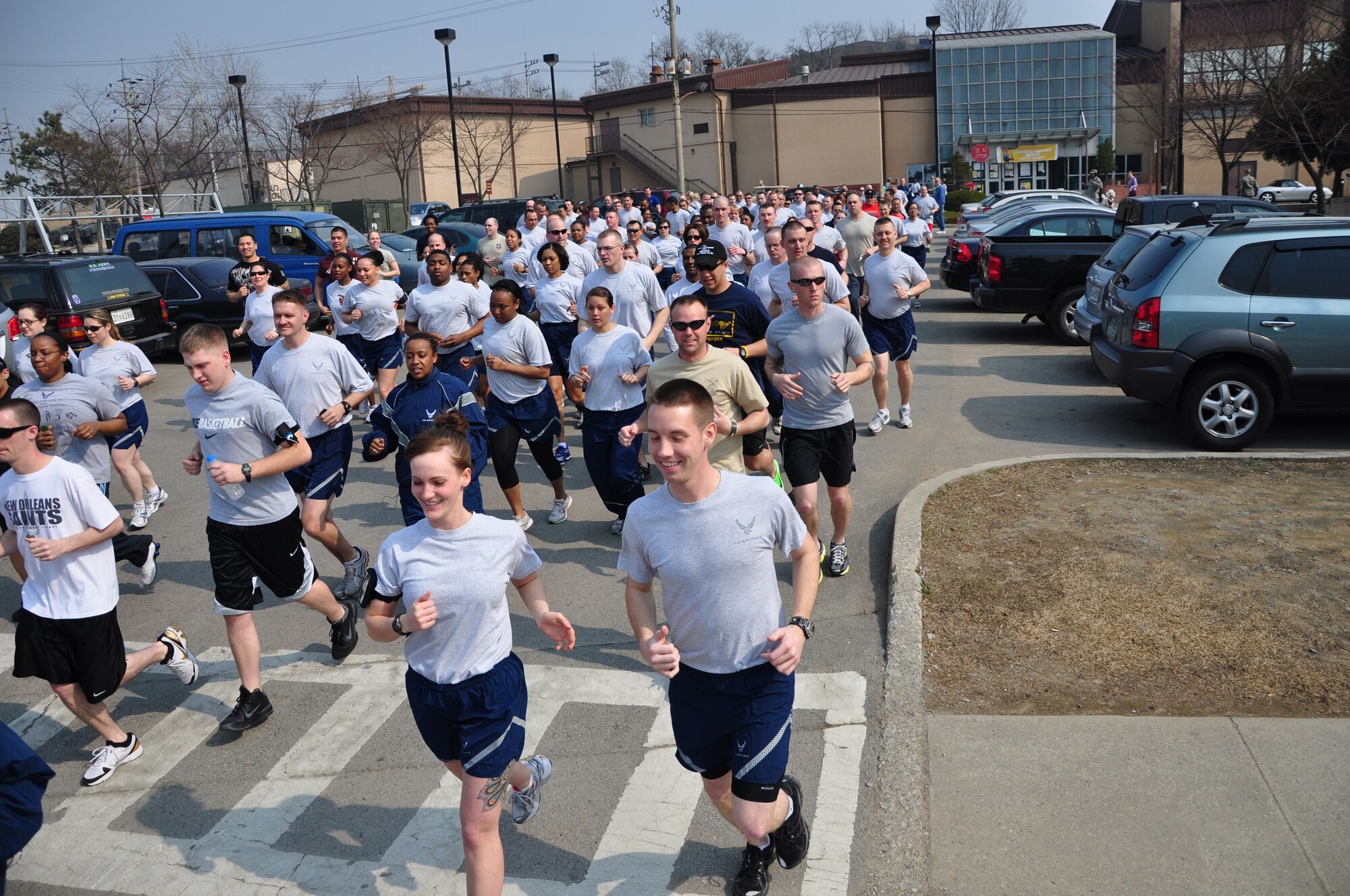 More than 100 Osan members met near the base fitness center to celebrate Women's History Month with a 5K-fun run March 31. (U.S. Air Force photo/Staff Sgt. Chad Thompson)