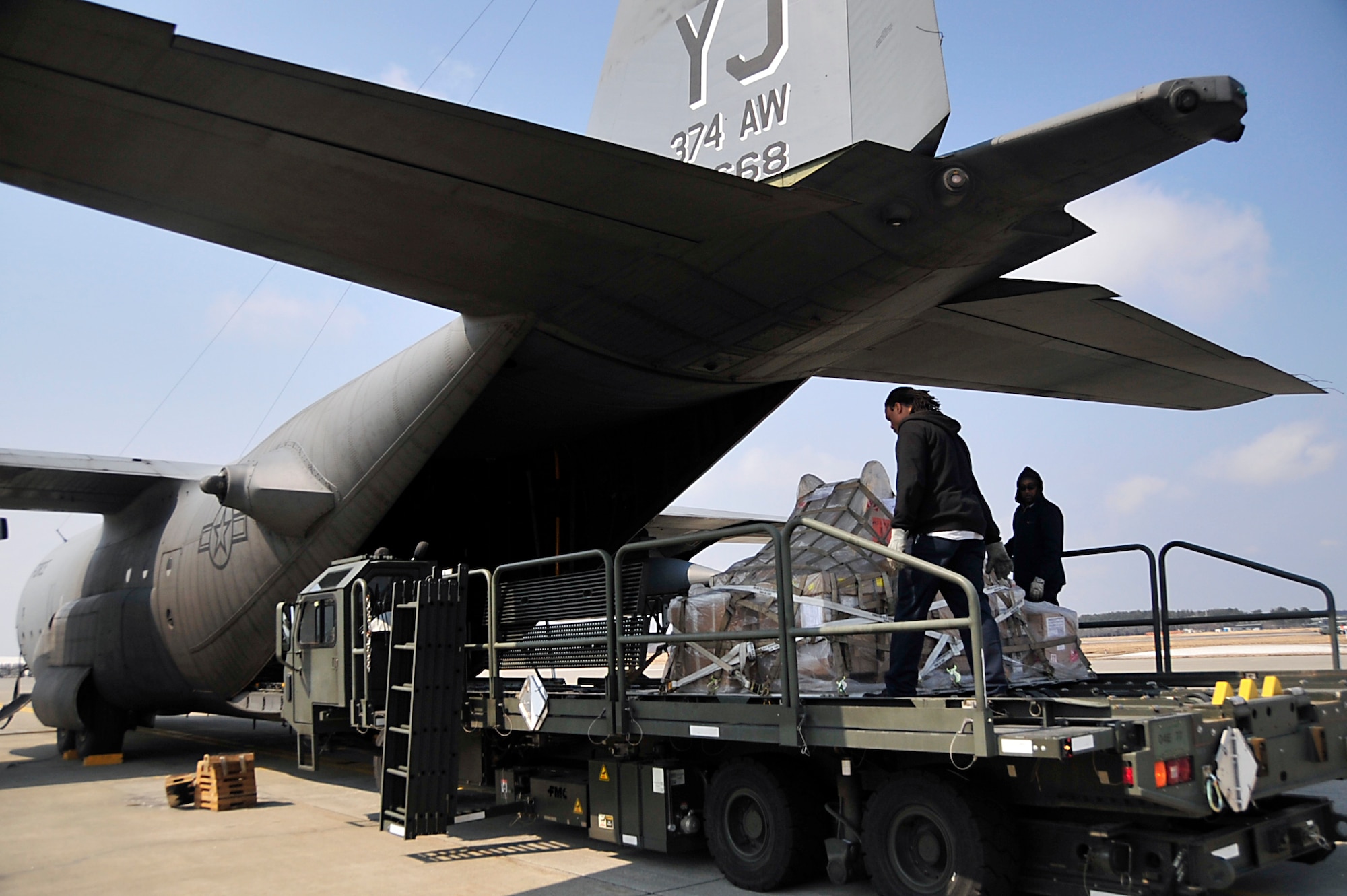 MISAWA AIR BASE, Japan -- Maytag employees upload cargo onto a C-130 Hercules March 31. Nearly one million pounds of cargo has been moved in and out of Misawa AB since Operation Tomodachi began. (U.S. Air Force photo by Staff Sgt. Marie Brown\Released)