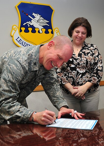 Col. Patrick Malackowski, 51st Fighter Wing commander, signs the Month of the Military Child proclamation here March 30. April is Child Abuse Prevention Month and Month of the Military Child and throughout the month the Family Advocacy staff will be offering many classes and programs that will help the Osan community become a better place for children. (U.S. photo/Staff Sgt. Daylena Gonzalez)
