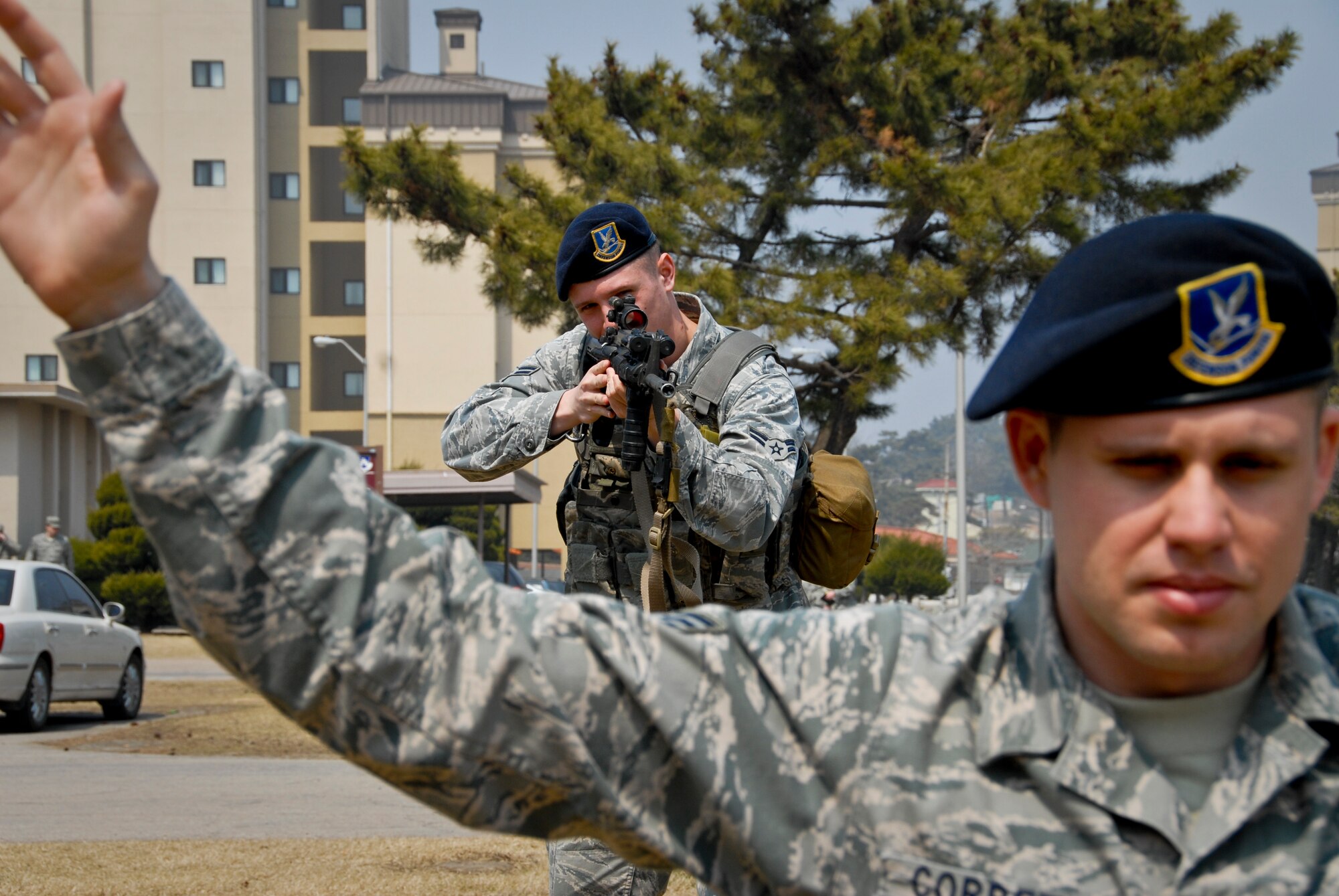 KUNSAN AIR BASE, Republic of Korea -- Airman 1st Class Adam Mathias, 8th Security Forces Squadron pass and registration clerk and first-term Airman, “arrests” Senior Airman Dwight Corbett, 8th SFS ration control clerk, here March 31 as they practice proper procedures in preparation for the upcoming Operational Readiness Inspection slated for the week of April 4. (U.S. Air Force photo/Senior Airman Benjamin Stratton)