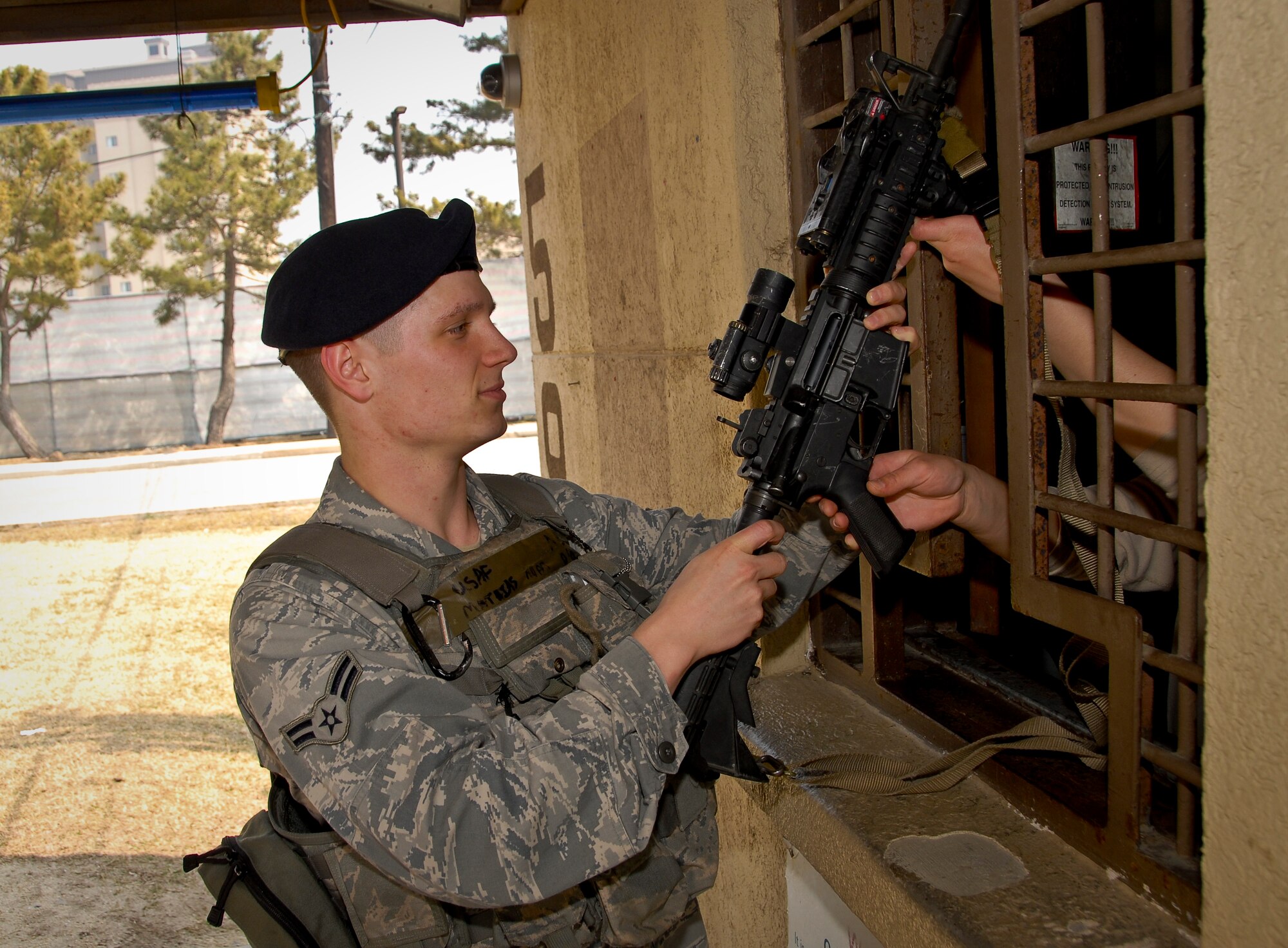 KUNSAN AIR BASE, Republic of Korea -- Airman 1st Class Adam Mathias, 8th Security Forces Squadron pass and registration clerk and first-term Airman, arms up here March 31 as he practices proper procedures for the upcoming Operational Readiness Inspection slated for the week of April 4. (U.S. Air Force photo/Senior Airman Benjamin Stratton)