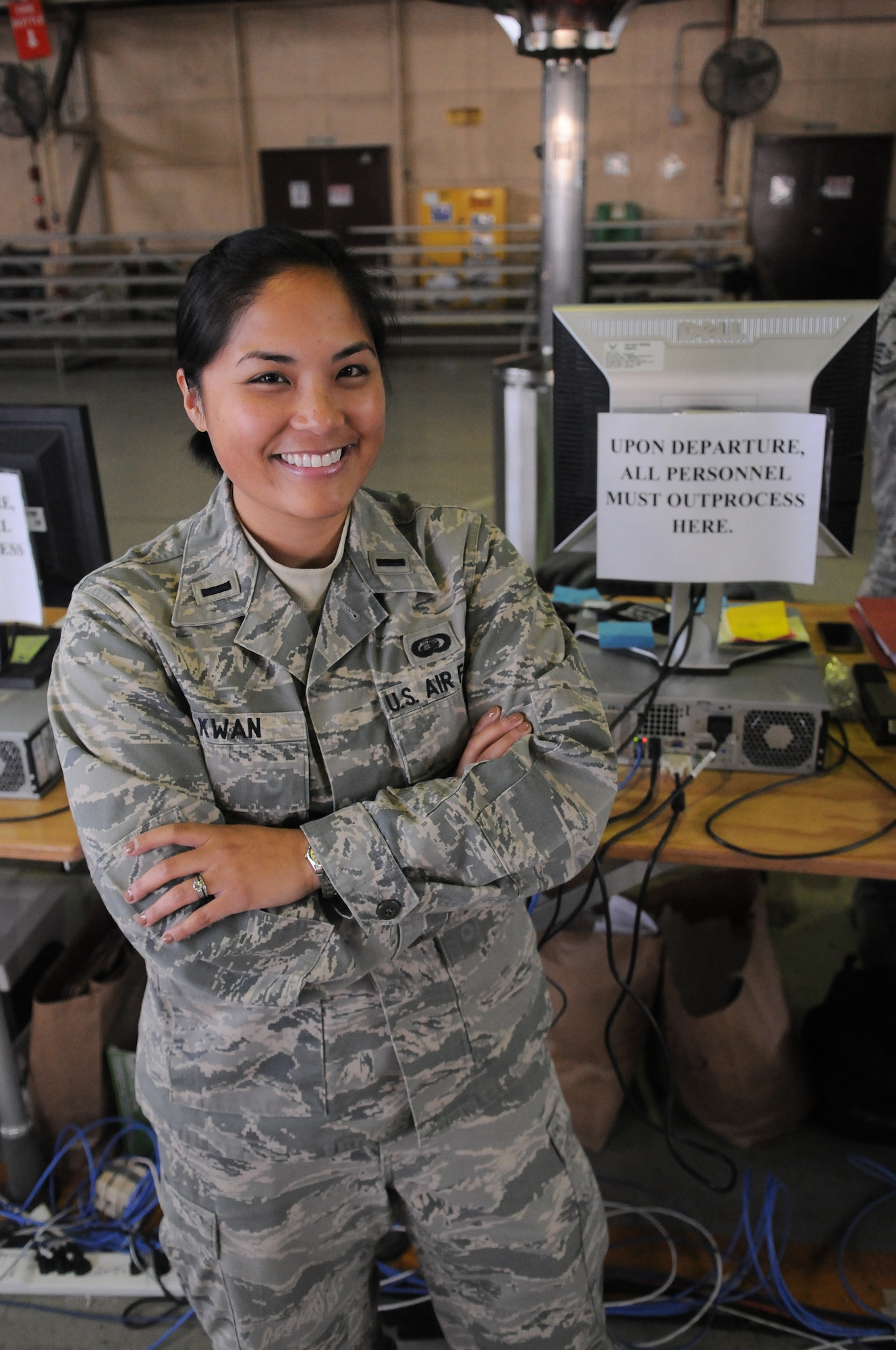 YOKOTA AIR BASE, Japan --Lt. Kailin Kwan, 374th Force Support Squadron chief of military personnel section, is the officer in charge of the joint reception center during the duration of Operation Tomodachi. Lieutenant Kwan, a native of San Jose, Calif., in processes and out processes all individuals that are stationed at and deployed to Yokota in support of Operation Tomodachi. ?My role as officer in charge of the joint reception center is key to tracking individuals who are in the country for accountability purposes,? said Lieutenant Kwan. ?We coordinate pax movement to the affected areas, so we play a vital role in getting the manpower help to those in need. I?m proud to support an operation that is helping our Japanese neighbors through these difficult times. This is a joint effort between our sister services and multiple other countries.? Along with her fellow Airmen, Lieutenant Kwan is working 12 hour shifts in support of Operation Tomodachi. (U.S. Air Force photo/Airman 1st Class Krystal M. Garrett) 