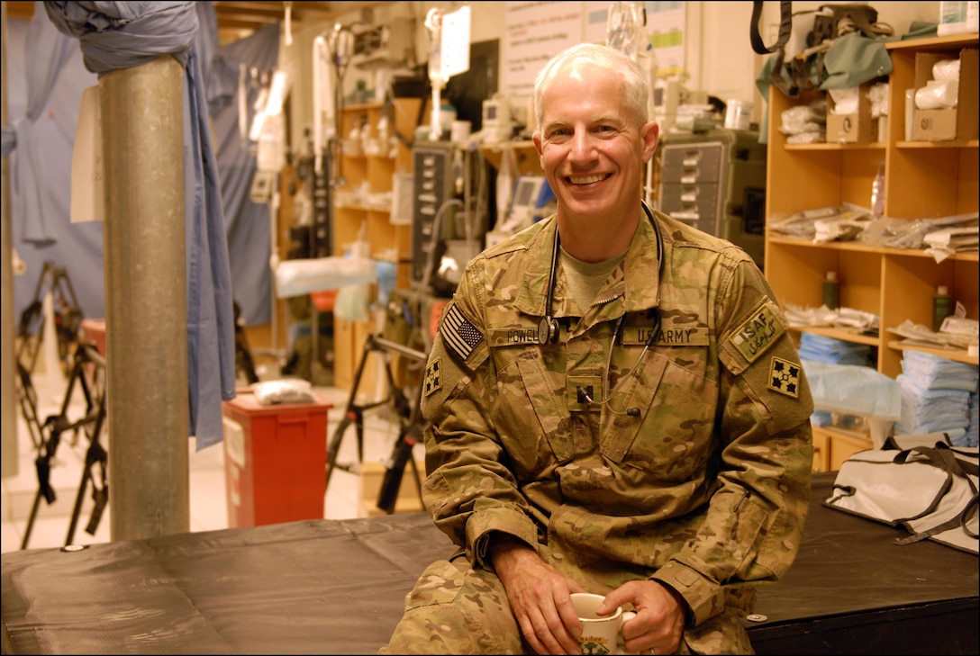 Army Capt. (Dr.) Douglas Powell left his job as a business executive to attend medical school and become a military physician. He oversees operations at the troop medical clinic at Camp Nathan Smith, Afghanistan. U.S. Army photo by Sgt. Breanne Pye