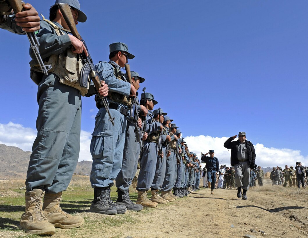 Afghan Uniform Police welcome officials from provincial capital Qalat as well as Zabul Provincial Gov. Ashraf Naseri in Zabul, Afghanistan, March 29, 2011. Naseri visited the district to discuss an Afghan Local Police initiative with elders. 