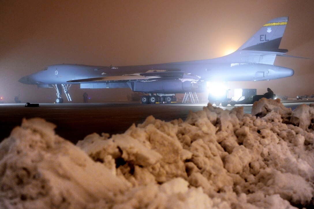 Airmen from the 28th Aircraft Maintenance Squadron prepare a B-1B Lancer March 27, 2011, at Ellsworth Air Force Base, S.D., to support Operation Odyssey Dawn. Their work was made difficult by severe weather conditions including snow, ice, and freezing fog. (U.S. Air Force photo/Staff Sgt. Marc I. Lane) 
