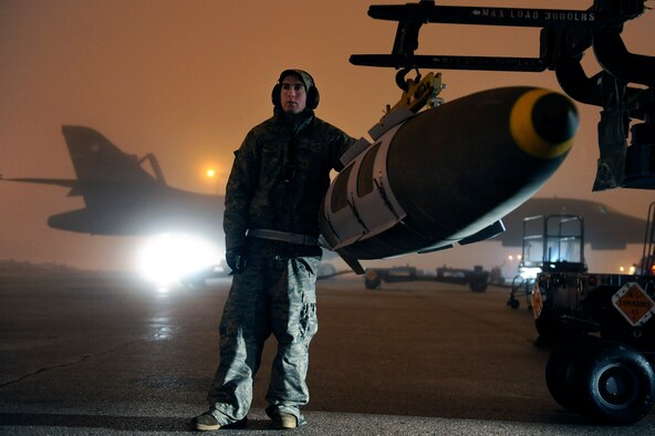 Airman Michael Doto, a 28th Aircraft Maintenance Squadron weapon systems technician, steadies a GBU-31 joint direct attack munition while preparing to load it on a B-1B Lancer on Ellsworth Air Force Base, S.D., March 27, 2011. B-1 bombers from the 28th Bomb Wing went on to strike targets in Libya in support of Operation Odyssey Dawn. (U.S. Air Force photo/Staff Sgt. Marc I. Lane)
