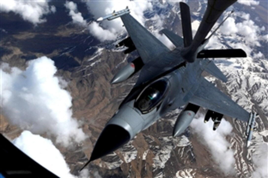 An F-16 Fighting Falcon assigned to the 555th Fighter Squadron based on Aviano Air Base, Italy, receives fuel from a KC-135 Stratotanker, assigned to the 340th Expeditionary Air Refueling Squadron, while flying over Afghanistan in support of Operation Enduring Freedom, March 29, 2011.