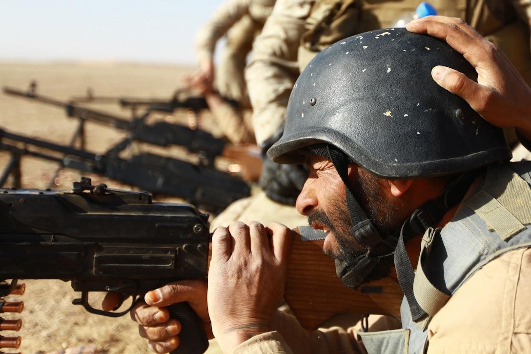 An Afghan soldier aims down range during the non-commissioned officer course at Joint Security Academy Southwest aboard Camp Leatherneck, March 31.