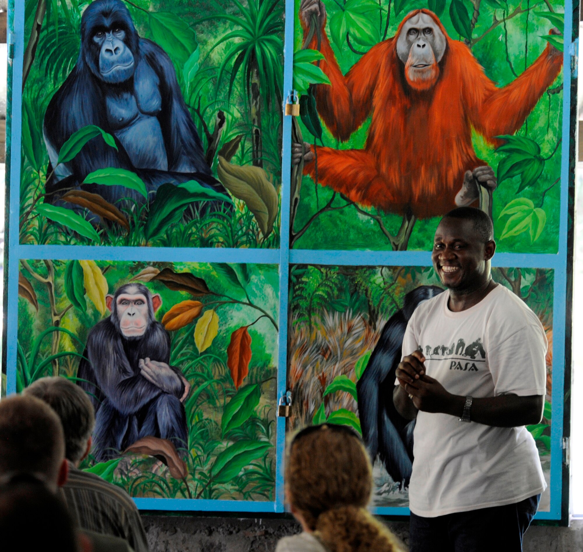 A tour guide for the LOLA YA BONOBO, a Bonobo ape sanctuary for the Democratic Republic of the Congo, explains the differences between the apes at the park compared to other apes found throughout the world, April 30, 2011 as part of a culture awareness day for MEDLITE 11. MEDLITE 11 is a joint medical exercise focused on aeromedical evacuation, to improve the readiness of U.S. Air Force and DRC personnel. (U.S. Air Force photo by Tech. Sgt. Todd Wivell)