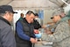 MISAWA AIR BASE, Japan -- Airmen from Misawa Air Base feed evacuation shelter residents in Miyako City April 23. Misawa Helps partnered with Focus 5/6 to offer American-style barbecue for the shelter residents. (U.S. Air Force photo/Staff Sgt. Clarence Armas)