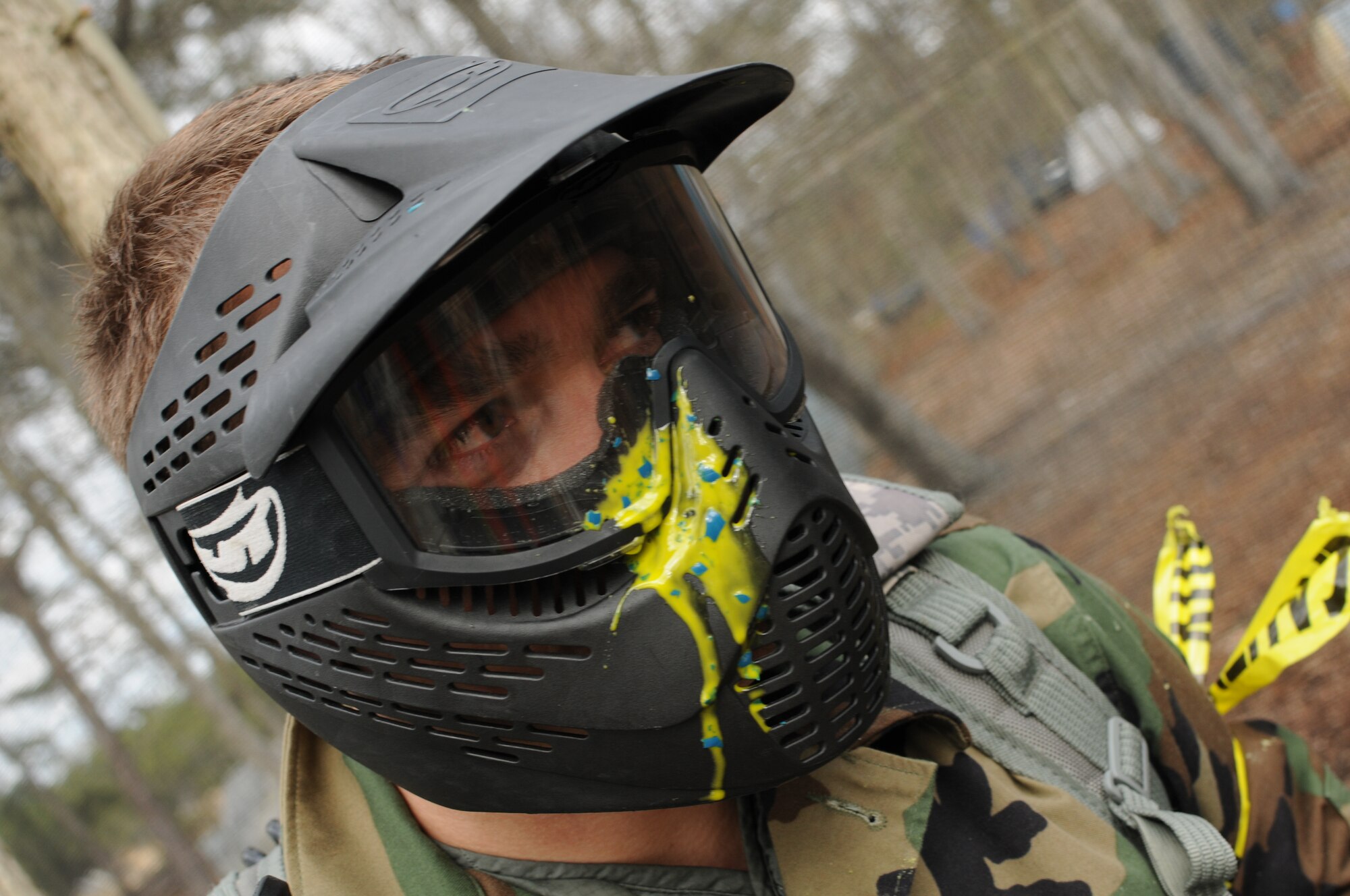 Airman First Class Luiz Vicentini of the 102nd Intelligence Wing Public Affairs office got hit in the face mask with a paintball during the May UTA Commanders Cup paintball tournament.
