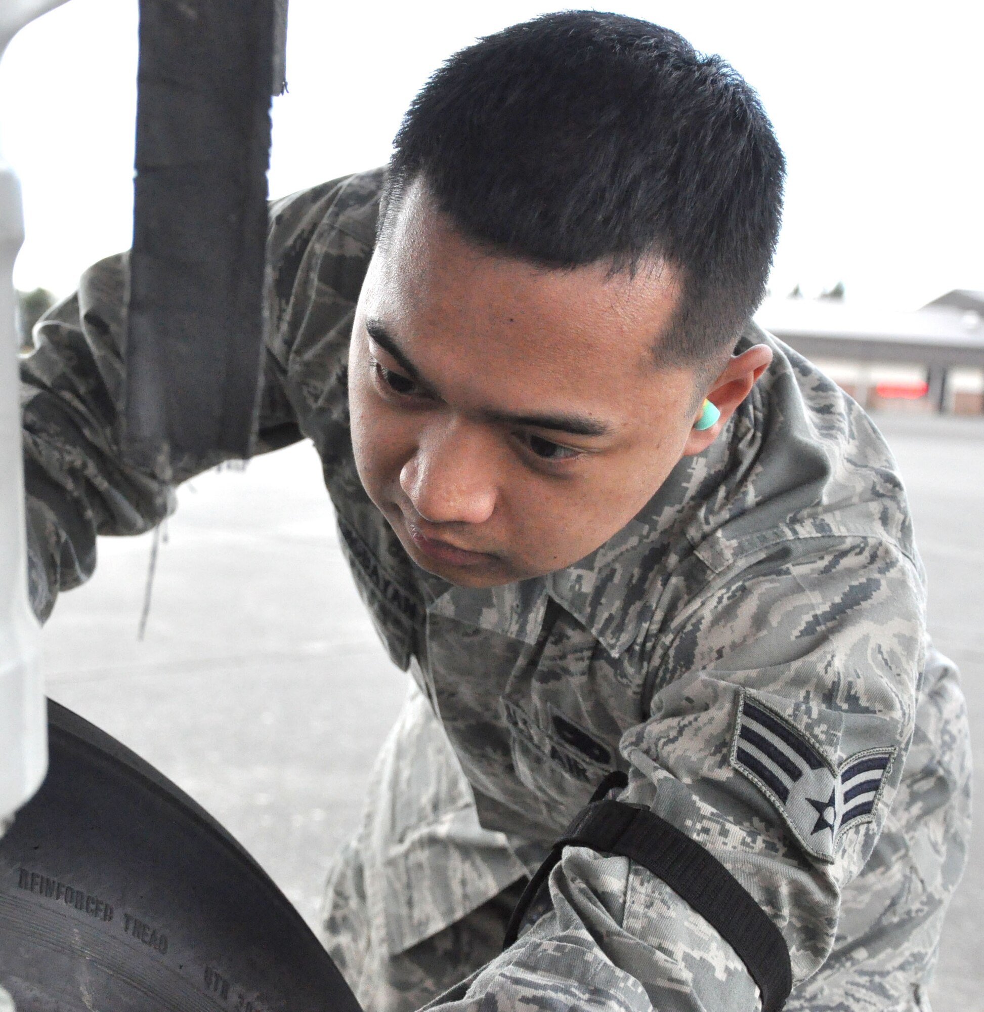 Air Force Senior Airman Eric Madlangbayan, an aircraft hydraulic technician journeyman with the 446th Aircraft Maintenance Squadron, McChord Field, Wash., inspects the struts on one of the many landing gear of the C-17 Globemaster III aircraft.  Airman Madlangbayan, a first-year Engineering student at Olympic College, Bremerton, Wash., is the squadron's most recent graduate from the Aircraft Hydraulic Technician technical training school, based at Sheppard Air Force Base, Texas. The Airman said his training helped him understand the mechanics of hydraulics and his career in the Air Force Reserve. (U.S. Air Force Photo/SSgt. Nicole Celestine)