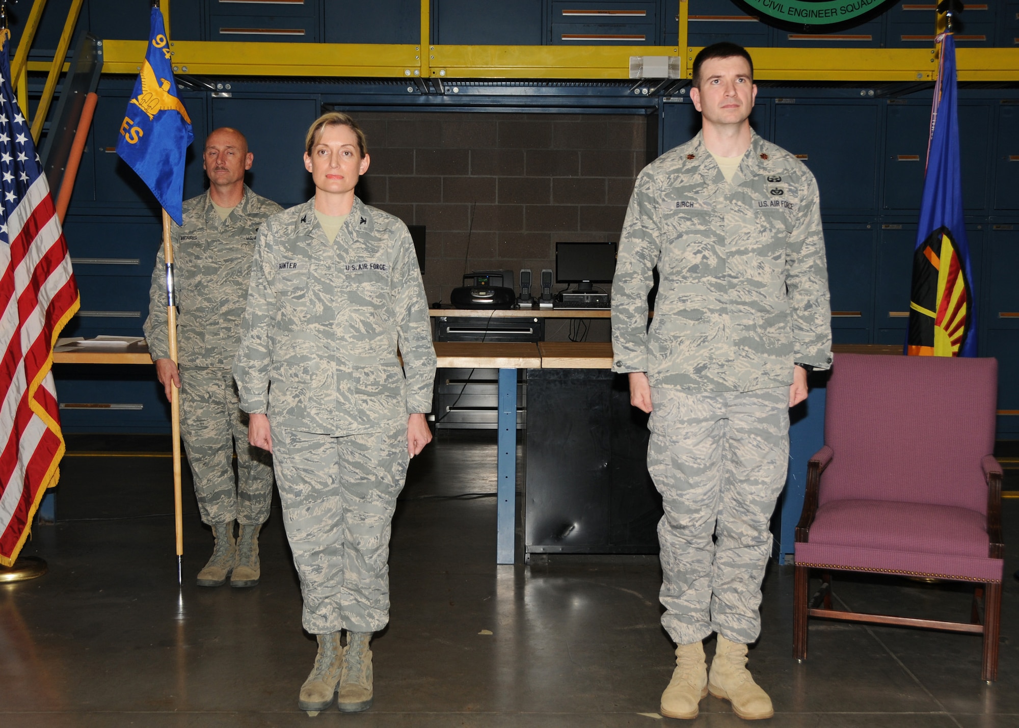 Colonel Anne B. Gunter, 944th Mission Support Group commander, and Major Jason J. Birch, 944th Civil Engineer commander, stand at attention as the Assumption of Command orders are read during the 944th Assumption of Command ceremony on April 30, 2011. (U.S. Air Force photo by Staff Sgt. Louis Vega Jr.)
