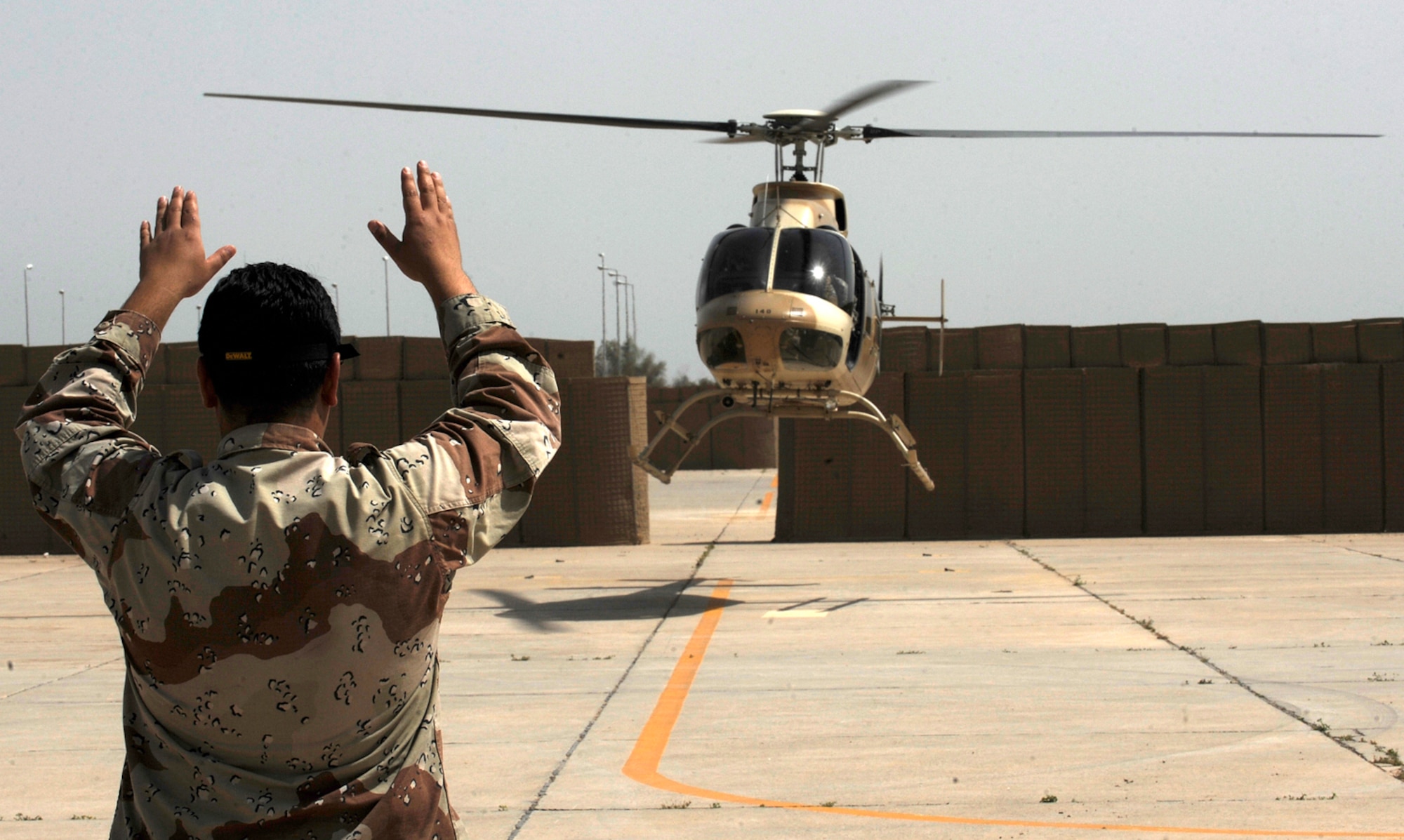 CAMP TAJI, Iraq -- Army Chief Warrant Officer Daniel Hill, a Nebraska National Guardsman from Grand Island, takes off on a T-407 training mission with his Iraqi co-pilot April 28. Mr. Hill and his teammate, Major Kevin Ferner, a Pennsylvania National Guardsman, are training more than 20 Iraqi Army Aviation Command pilots at Squadron 21 to fly the trainer aircraft. (U.S. Air Force/Tech. Sgt. Jason Lake)  