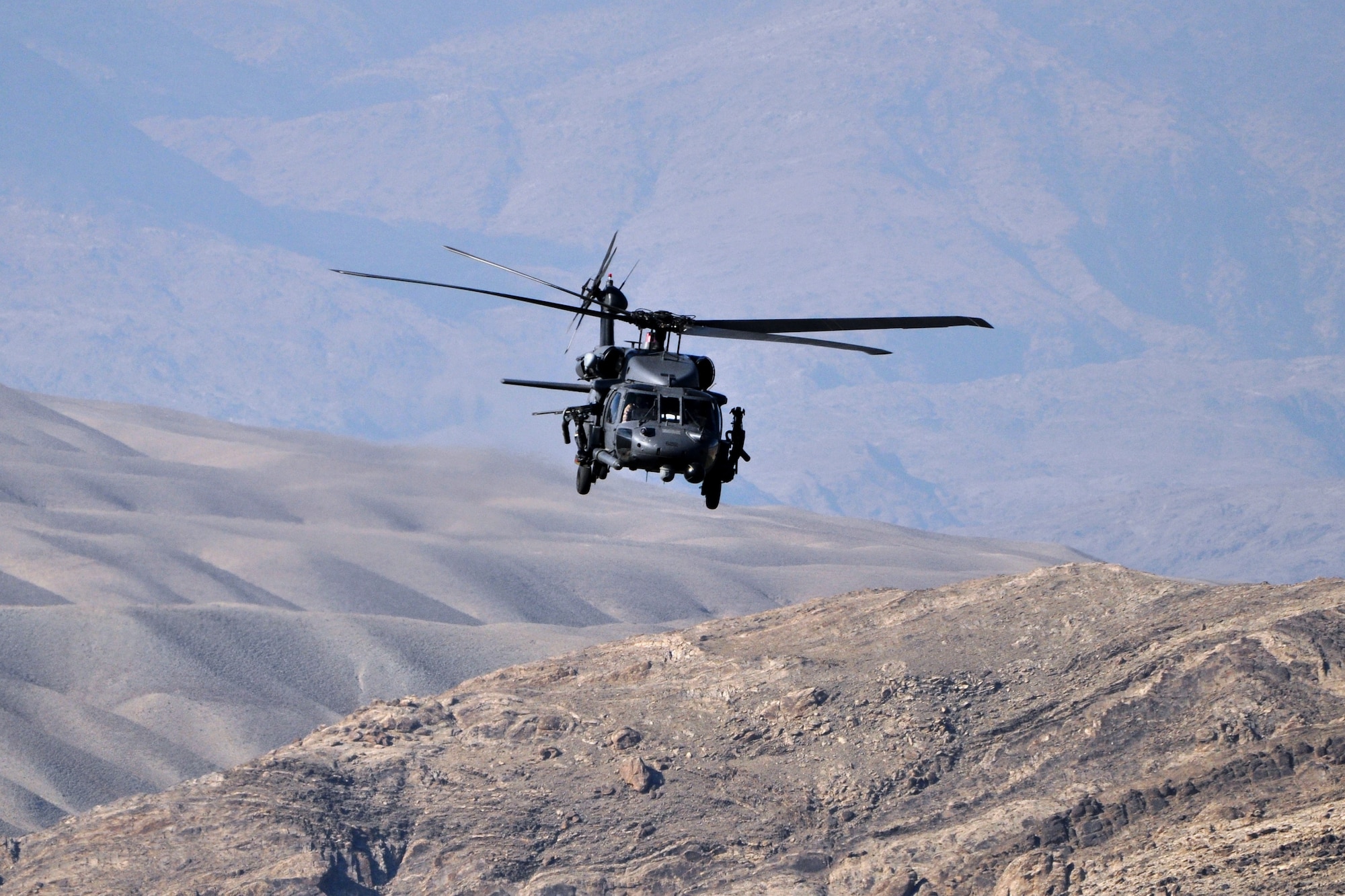 An HH-60G Pavehawk assigned to the 83rd Expeditionary Rescue Squadron returns from a forward operating base where they supported ground forces earlier this year.  Airmen from Bagram's 83rd ERQS recently flew into a hostile valley, April 23, 2011, to recover the pilots of a downed Army helicopter. (U.S. Air Force photo by Capt. Erick Saks)
