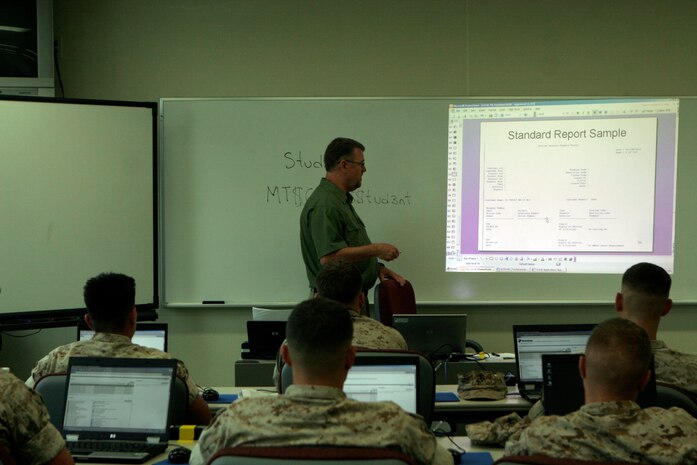 Gene Shepherd, a Global Combat Support System-Marine Corps instructor, teaches Marines of the 31st Marine Expeditionary Unit how to use the revolutionary system, May 2. The 31st MEU is the first MEU in the Marine Corps to utilize the system.