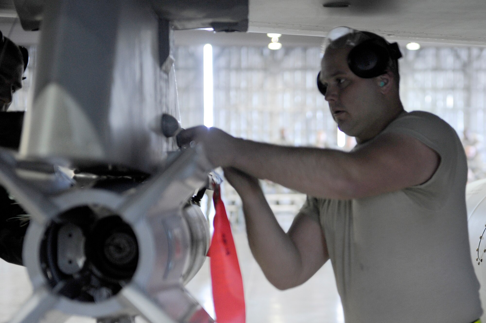 MISAWA AIR BASE, Japan -- Senior Airman Jacob Wilbanks, 14th Aircraft Maintenance Unit weapons load crew member, secures a Guided Bomb Unit-12 onto an F-16 pylon April 29. The teams total score will be compared against the 13 AMU's total socre to determine the winner. (U.S. Air Force photo/Staff Sgt. Marie Brown/Released)
