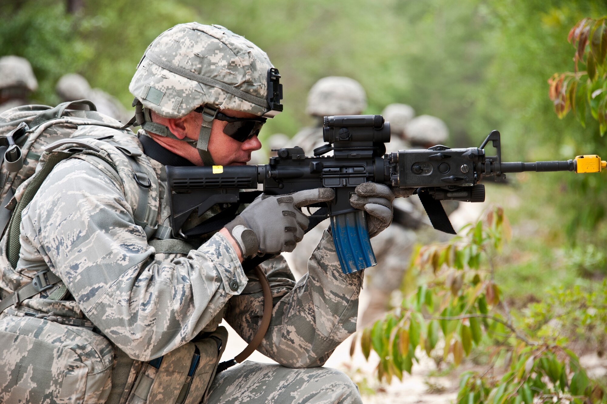 Maj. Justin Oldt, 99th Mission Support Group, takes position in a line of security forces Airmen on patrol April 27 at Eglin Air Force Base, Fla.  This was part of Air Force Materiel Command’s "Brave Defender" training, which is administered by the 96th Ground Combat Training Squadron.  GCTS instructors push 10 training classes a year, which consists of improvised explosive device detection and reaction, operating in an urban environment, mission planning, land navigation and casualty care.  More than 140 Airmen from more than 12 locations attended this training.  (U.S. Air Force photo/Samuel King Jr.)