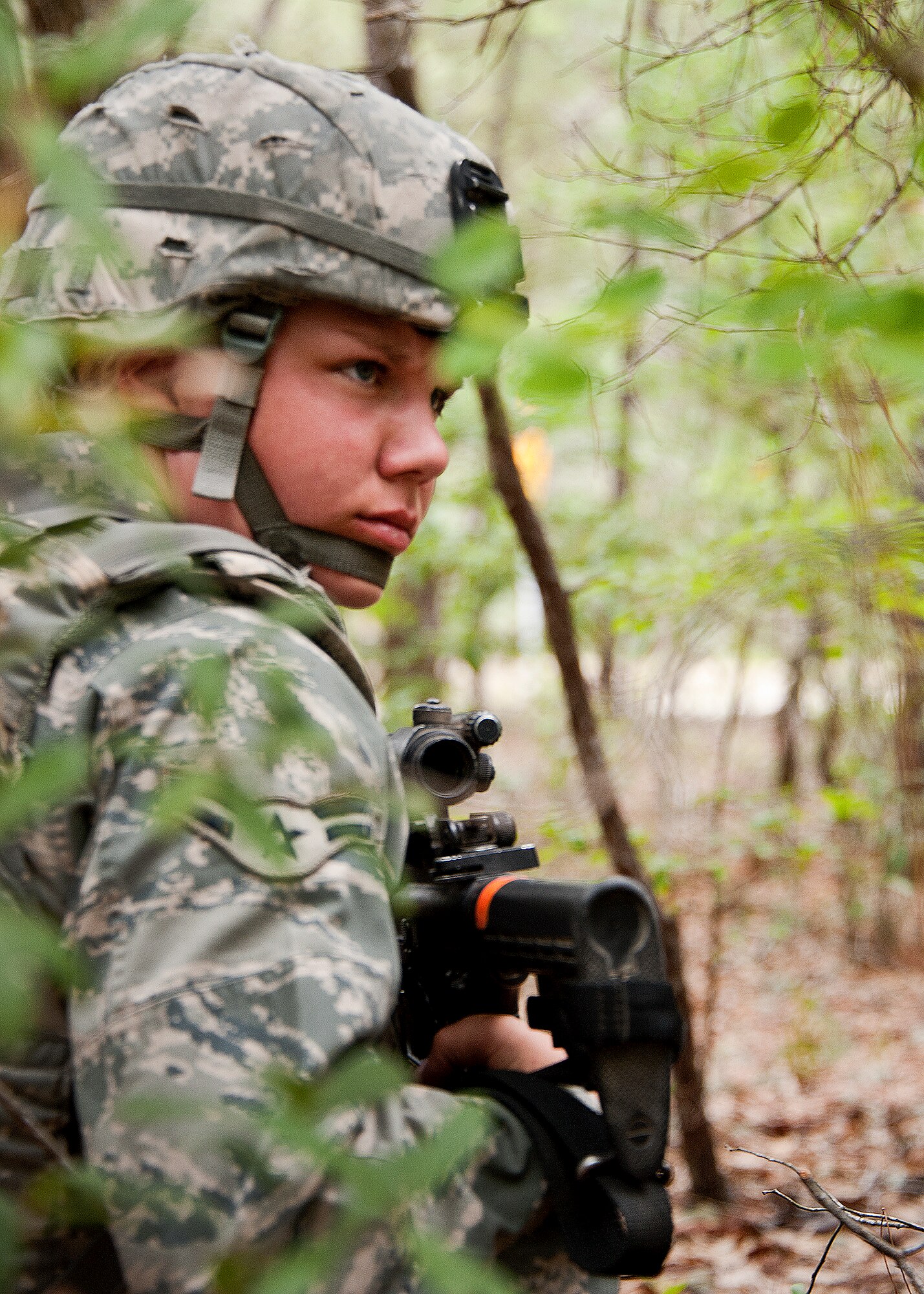 Airman 1st Class Jocelyn Lord, 97th Security Forces Squadron, listens to instructions from her team lead during a simulated mission April 27 at Eglin Air Force Base, Fla.  This was part of Air Force Materiel Command’s "Brave Defender" training, which is administered by the 96th Ground Combat Training Squadron.  GCTS instructors push 10 training classes a year, which consists of improvised explosive device detection and reaction, operating in an urban environment, mission planning, land navigation and casualty care. More than 140 Airmen from more than six major commands attended this training.  (U.S. Air Force photo/Samuel King Jr.)